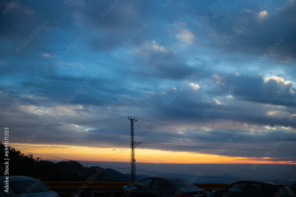 Beautiful Sunset over the city with mountains Beautiful Sunset over the city with mountains
