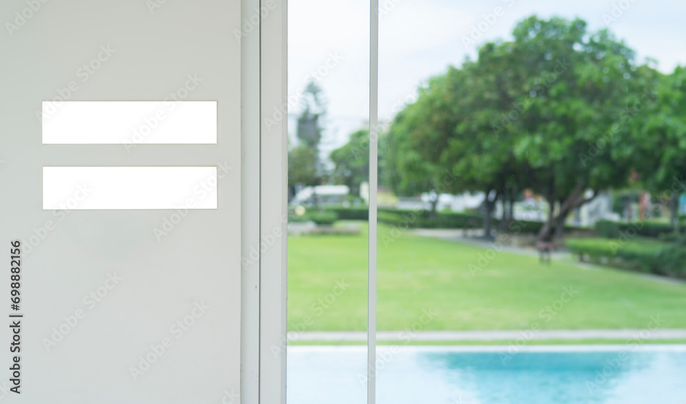 Small blank sign board stand on white wall background near swimming pool with copy space Small blank sign board stand on white wall background near swimming pool with copy space