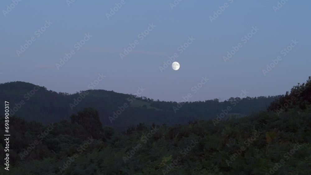 View of Moon Over Mountains in Spain, Asturias. Moonrise at Dusk View of Moon Over Mountains in Spain, Asturias. Moonrise at Dusk