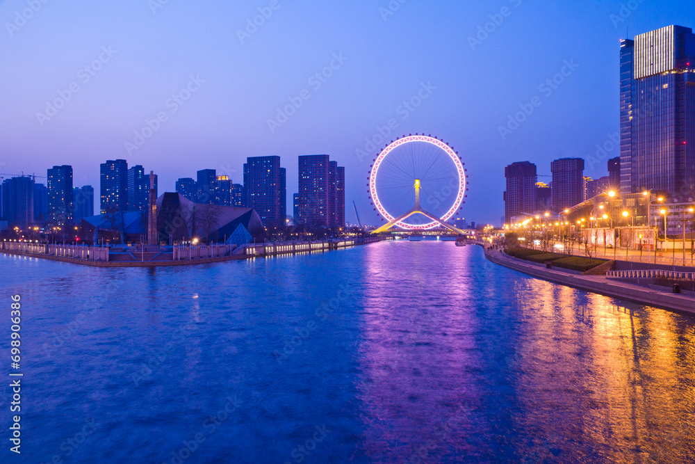 Cityscape of Tianjin ferris wheel,Tianjin eyes in twilight time in Tianjin city, China.