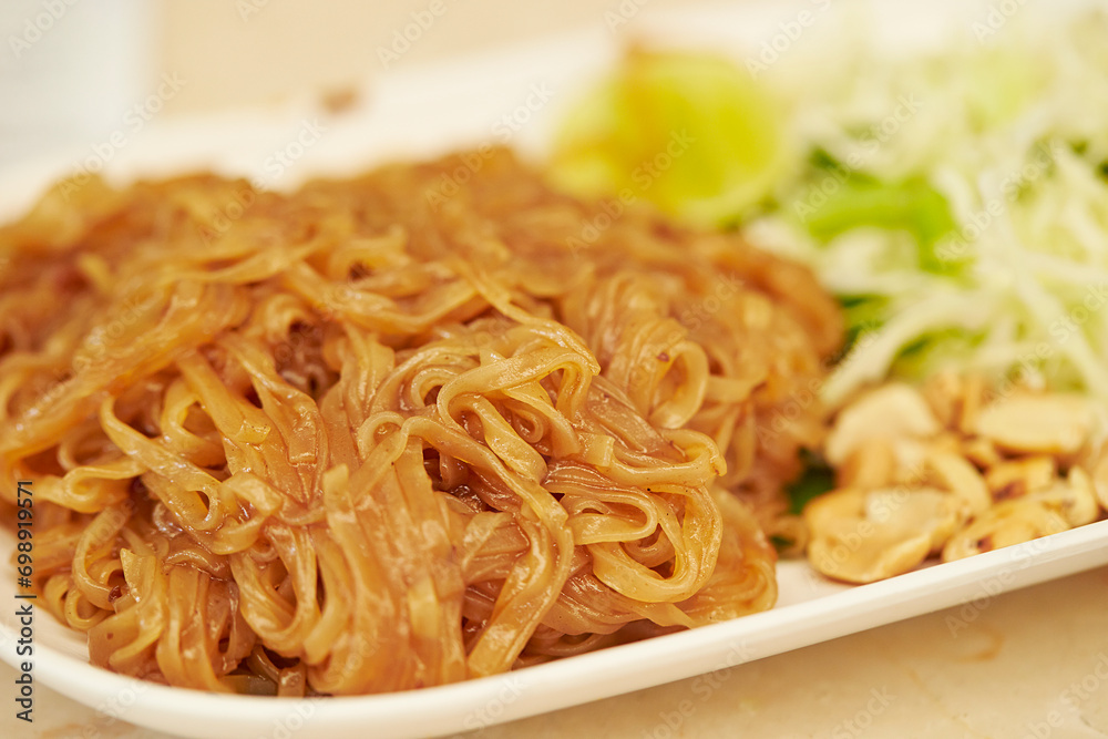 Fried noodles with vegetables on a plate