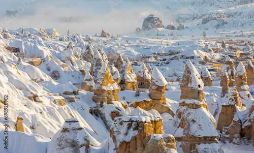 Pigeon Valley and Cave town in Göreme in winter, Fairy chimneys, Cappadocia, Turkey.