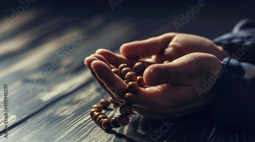 A religious Muslim prays with rosary