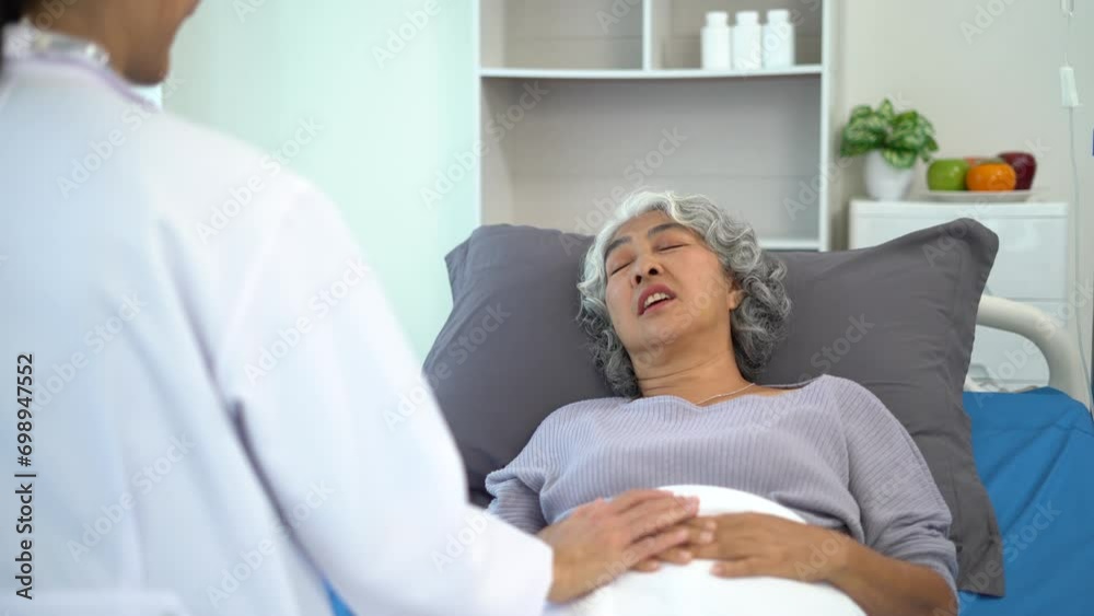doctor talking with woman patient for monitoring and check up after surgery. doctor touching patient hand and consoling. doctor talking with woman patient for monitoring and check up after surgery. doctor touching patient hand and consoling.