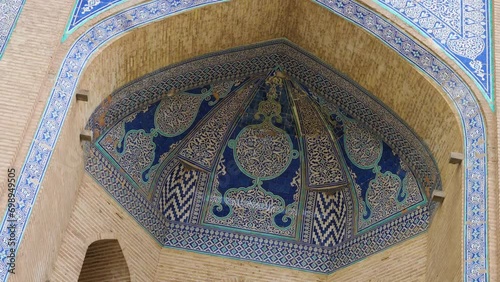 Entrance to the Allakuli Khan madrasah. The facade is decorated with majolica patterns in white and black, as well as shades of blue and blue photo
