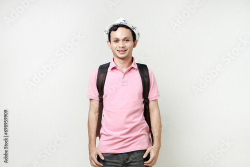 Asian man backpacker portrait. digital nomad and travelling concept. on isolated background