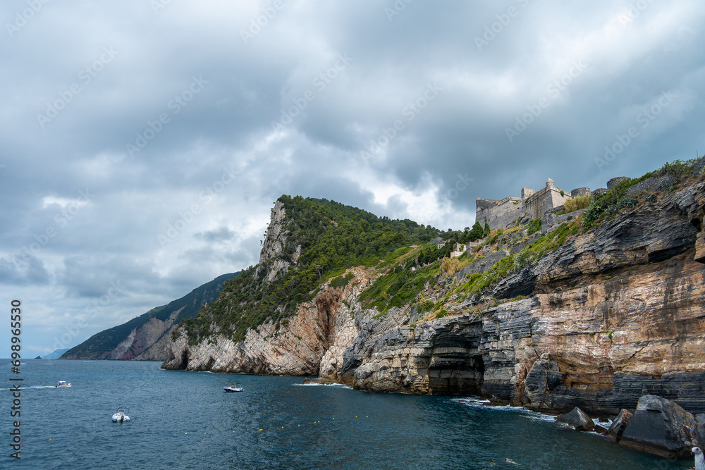 Portovenere, Italy, July 30, 2023. Doria Castle, military fortress, on the heights of the sea and the village
