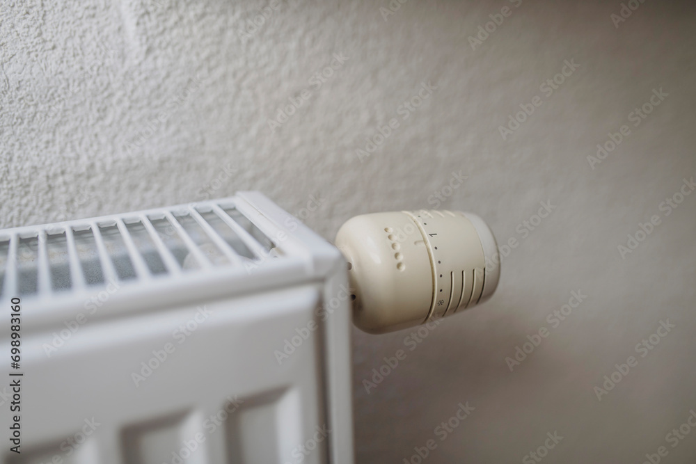Radiator with regulator near white wall Radiator with regulator near white wall