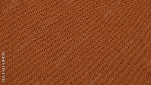 Soft Knitted Woolen Detailed Texture. Natural Fabric Closeup Knit Pattern. Brown Knitwear, Warm Cashmere Surface. Rotation, Macro. Cozy Textile Background. Clothes Production. Melange Yarn. Terracotta photo