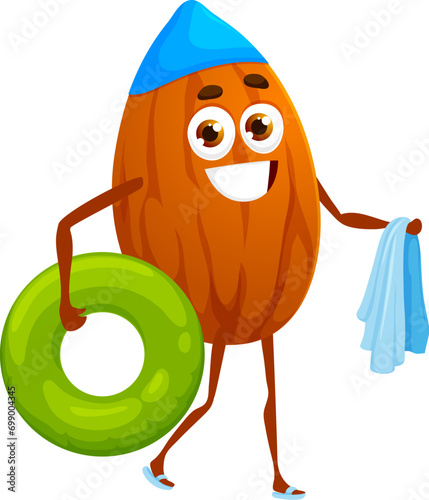Cartoon almond nut character enjoys a beach stroll, carrying towel and rubber ring. Isolated vector playful whimsical kernel personage having water fun and joy at sunny day by the sea or swimming pool