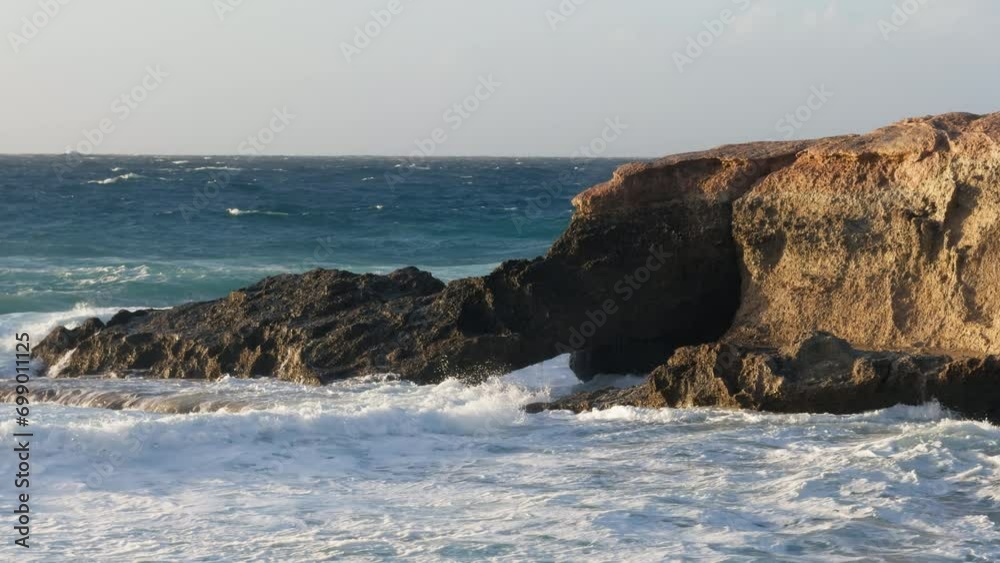 Rough sea breaks on the cliff Rough sea breaks on the cliff