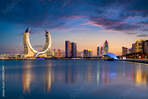 Lusail, Qatar - December 26, 2023: Katara buildings view from Lusail Marina Park. Crescent Tower  Fairmont doha  photo