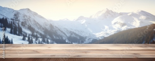 blank wooden table with mountain background in winter