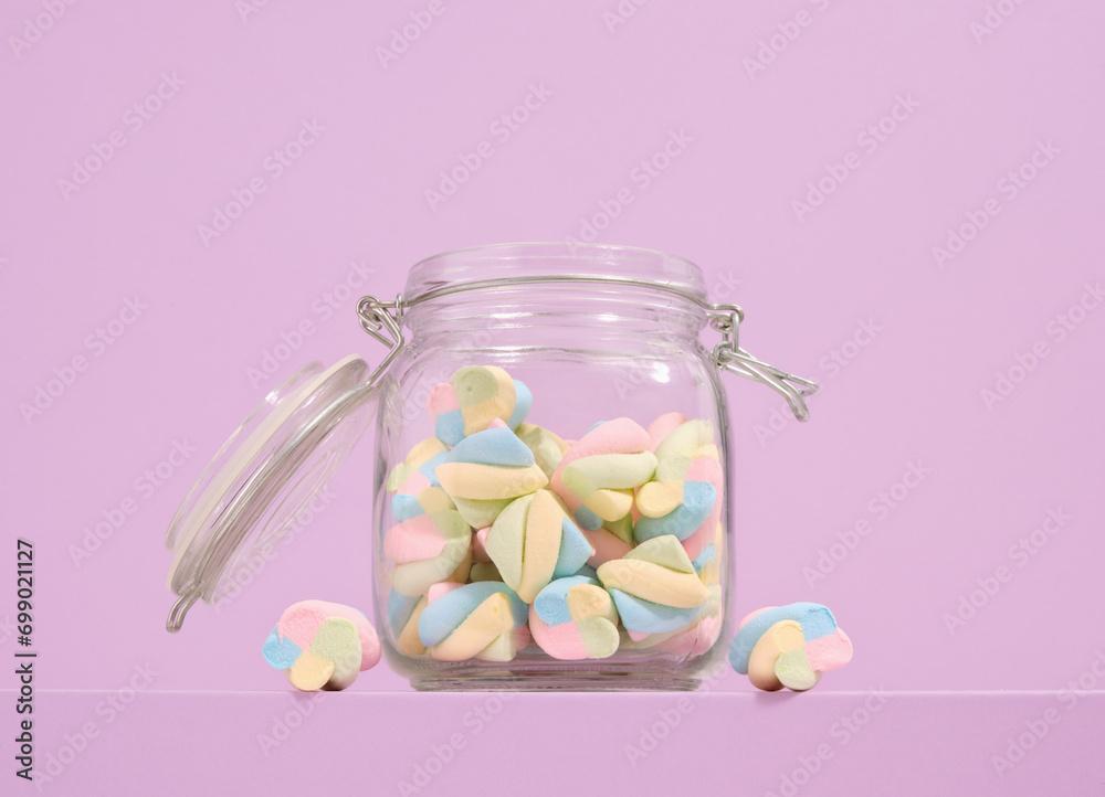 Fresh marshmallows in a glass jar. Colorful and bright sweet mood. Fresh marshmallows in a glass jar. Colorful and bright sweet mood.