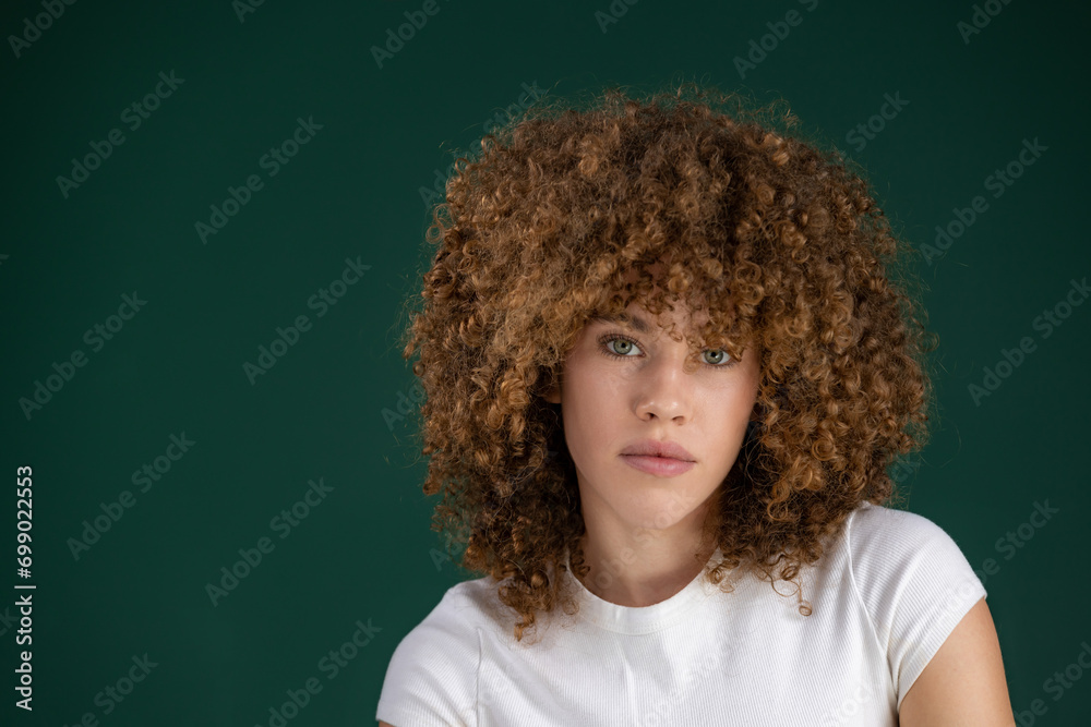 close up portrait of beautiful young woman with curly hair 