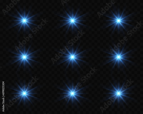 Shining stars on a transparent background. The star flashed with bright light. Sparkling glare, magical particles of light.