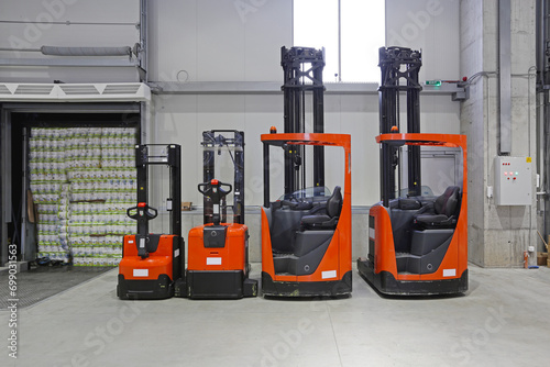 Obraz na płótnie Pallet Truck Forklift Vehicles in Distribution Warehouse w salonie