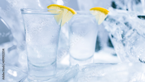 Two glasses of vodka with ice and lemon