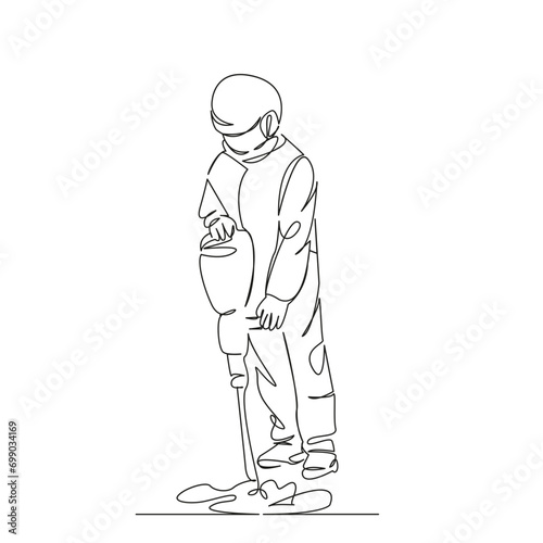 worker hammering with a hammer drill