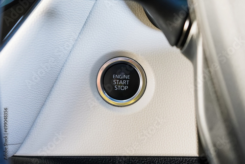 Close up engine car start button. Start stop engine modern new car button,Makes it easy to turn your auto mobile on and off. a key fob unique ,selective focus	 photo