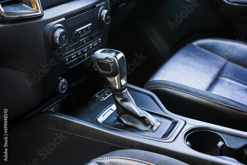 automatic transmission shift selector in the car interior. Closeup a manual shift of modern car gear shifter. 4x4 gear shift 