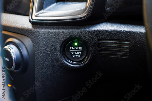 Close up engine car start button. Start stop engine modern new car button,Makes it easy to turn your auto mobile on and off. a key fob unique ,selective focus  © Muanpare