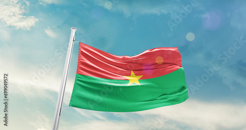 Burkina Faso national flag cloth fabric waving on the sky - Image