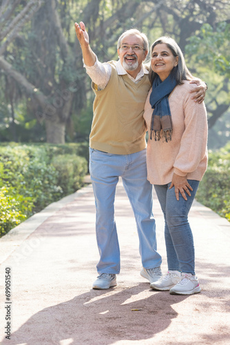 Happy senior couple spending leisure time in park.