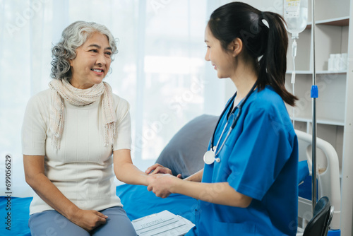 Wallpaper Mural Close up of medical worker putting his fingers on a wrist of a female patient while checking her pulse during an appointment.Taking care of health. Torontodigital.ca