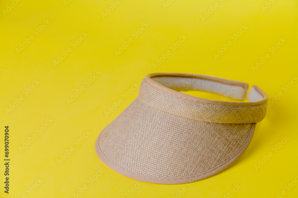 Visor on yellow background. Visor concept. Concept for summer. Copy space. Visor on yellow background. Visor concept. Concept for summer. Copy space.