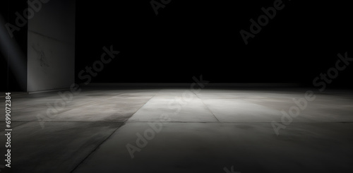 Rough textured surface with cracks in the grey concrete floor . Texture or background.