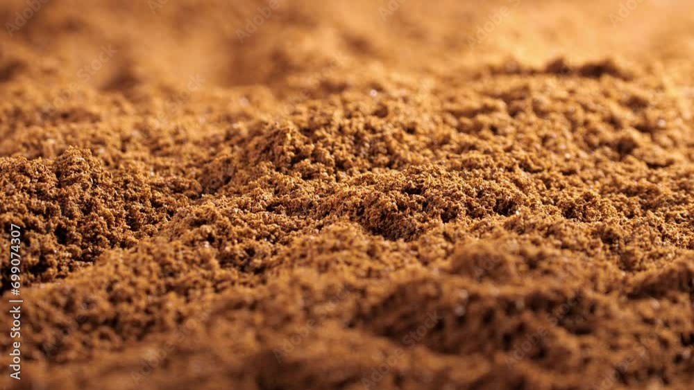 Textured ground coffee showcasing the natural beans of Arabica. A rich background for coffee enthusiasts Textured ground coffee showcasing the natural beans of Arabica. A rich background for coffee enthusiasts