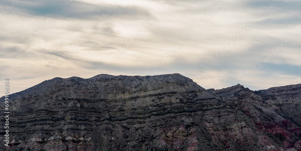 high rocky mountains and cloudy sky with clouds high rocky mountains and cloudy sky with clouds