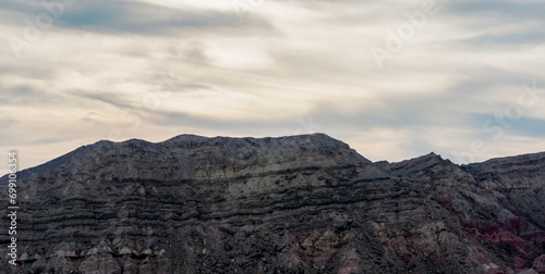 high rocky mountains and cloudy sky with clouds