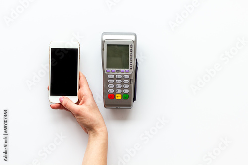 POS payment terminal reader with mobile phone. Online banking concept