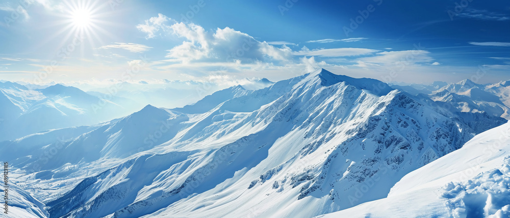 Obraz premium Sunlit mountain landscape with snow-capped peaks and serene alpine surroundings