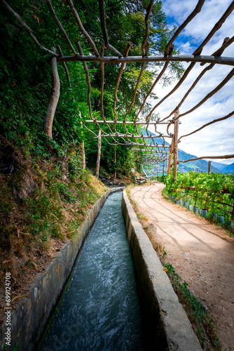 Hiking along the Marlinger Waalweg near Meran in South Tyrol Italy. With some Views over wineyards, the City of Meran, Marling and other Villages