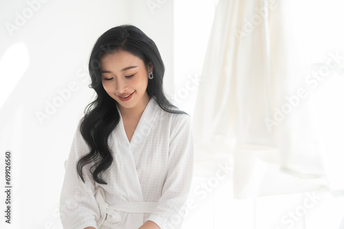 Bride in White bathrope Smiling in wedding day, Love and marriage concept photo