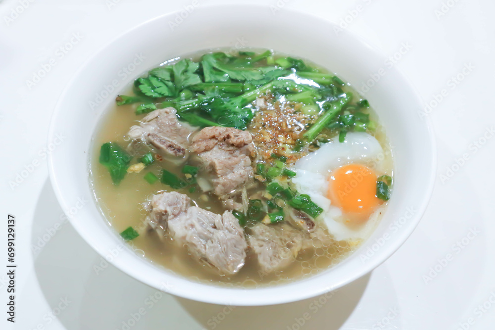 pork soup or pork rib soup with egg and vegetable or boiled rice with pork or boiled rice soup and egg