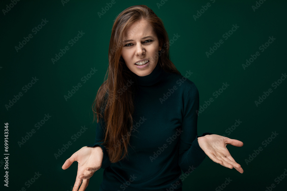 Headshot portrait of a woman with brown natural hair with confusion on her face Headshot portrait of a woman with brown natural hair with confusion on her face