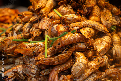 A pile of fresh mantis shrimp, a popular seafood dish in Wuchang , China. The shrimp are bright red and have a unique lobster appearance.