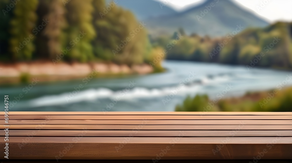 The empty wooden brown table top with blur background of river and mountain. Exuberant image.