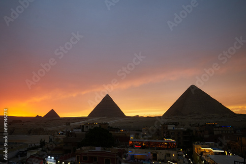Panoramic view of Giza Pyramids during dramatic sunset