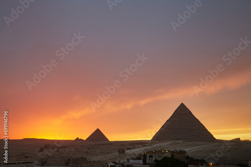 Panoramic view of the Giza Pyramids during dramatic Sunset