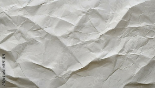 wrinkled paper background, a white blank crumpled paper texture, a surface that beckons with the soft whispers of its own history. textured backdrop graciously awaits the narrative grace of your chose photo