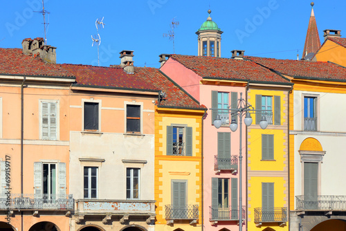 palazzi storici colorati su piazza vittoria di lodi in italia, colorful historical buildings on piazza vittoria in lodi city in italy 
