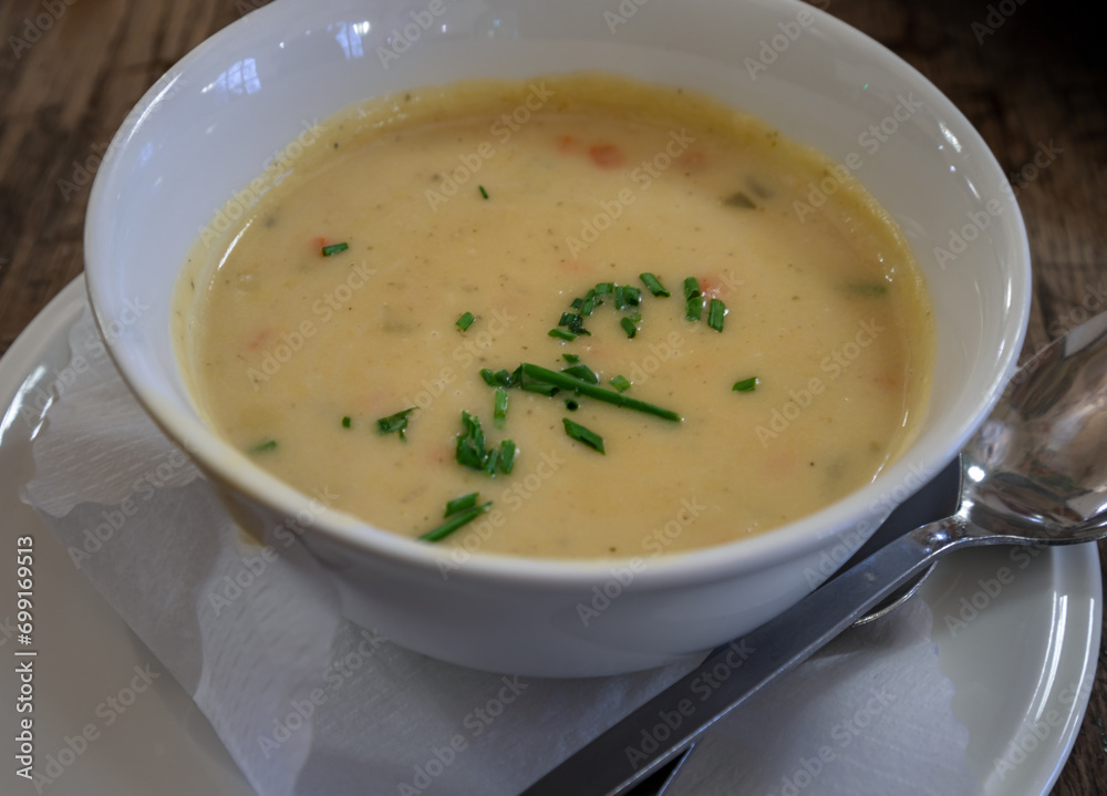 Cream of potato and vegetable soup on ceramic bowl. Space for text, Selective focus. Cream of potato and vegetable soup on ceramic bowl. Space for text, Selective focus.