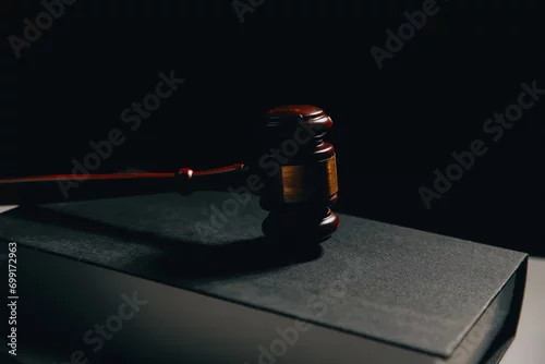 Obraz image of judge's hammer, scales lady of justice, law book, laptop computer and contract documents with pen concept of law and justice.