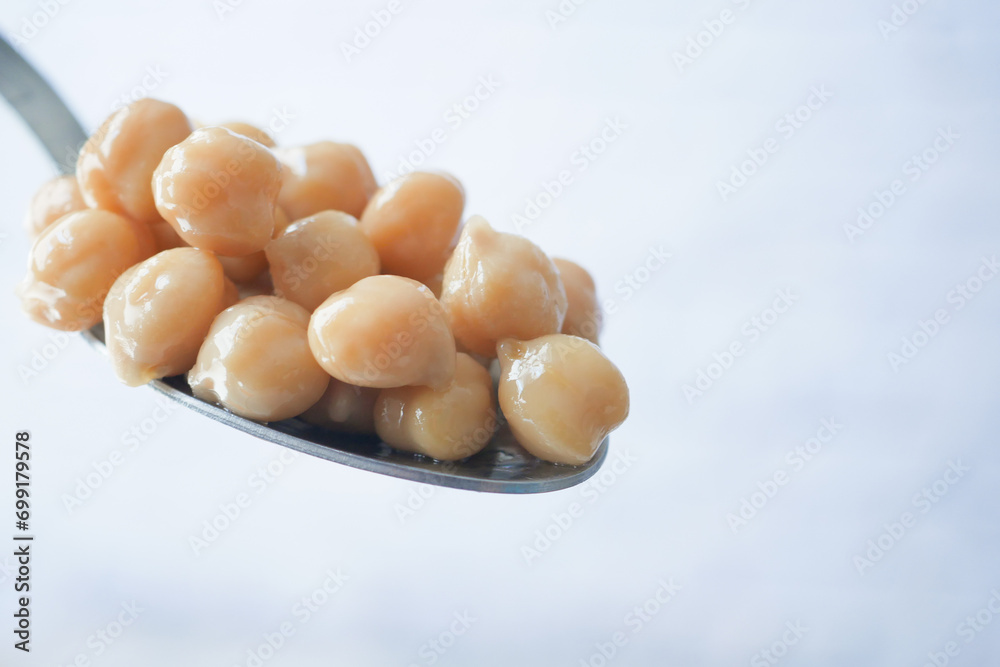 Boiled chickpeas on a spoon closeup Boiled chickpeas on a spoon closeup
