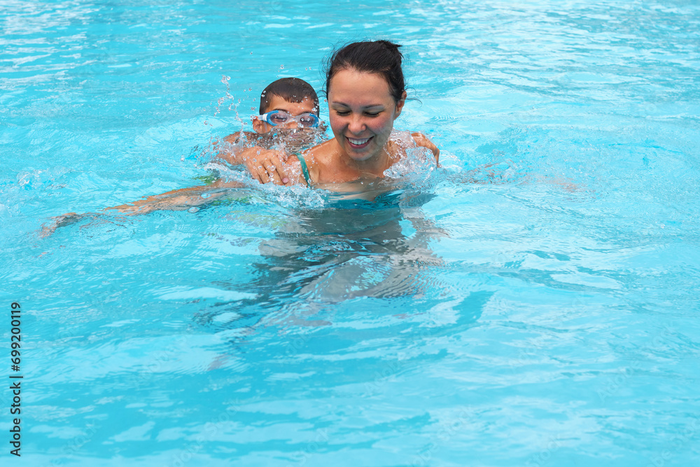 Vacation vitality in the water; mother-son duo. Captures the essence of the trend towards active family holiday experiences.